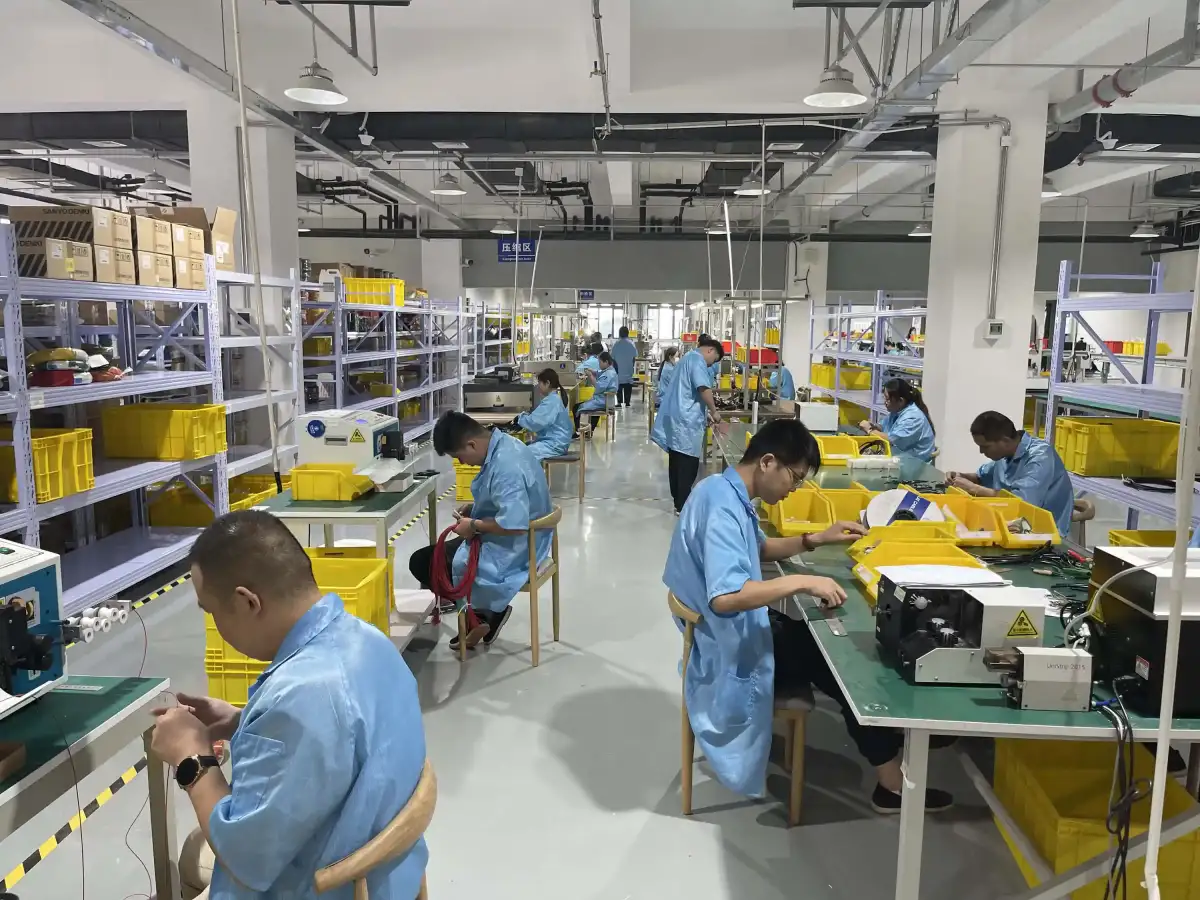 VeinWire wire harness assembly line with crimping and termination workstations